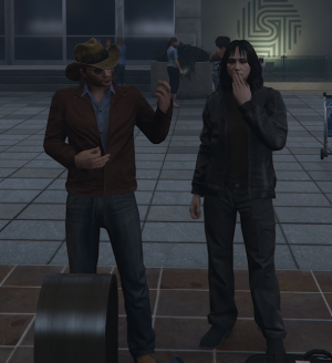 Jim doing air guitar standing next to Yue blow kissing, waiting on the plane at the airport